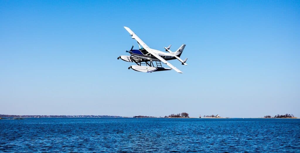 Seaplane Flying Over a Beautiful Blue Harbor